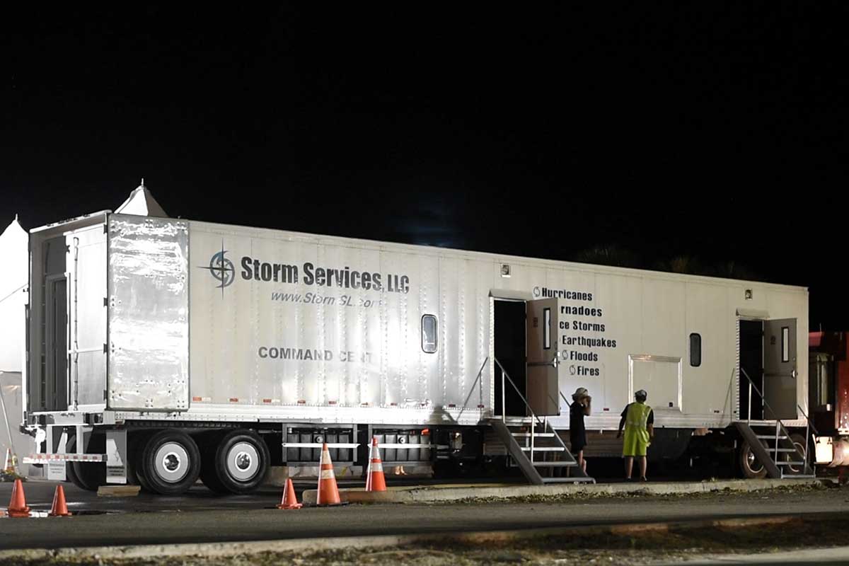 Command Center trailer deployed at a post-storm base camp.