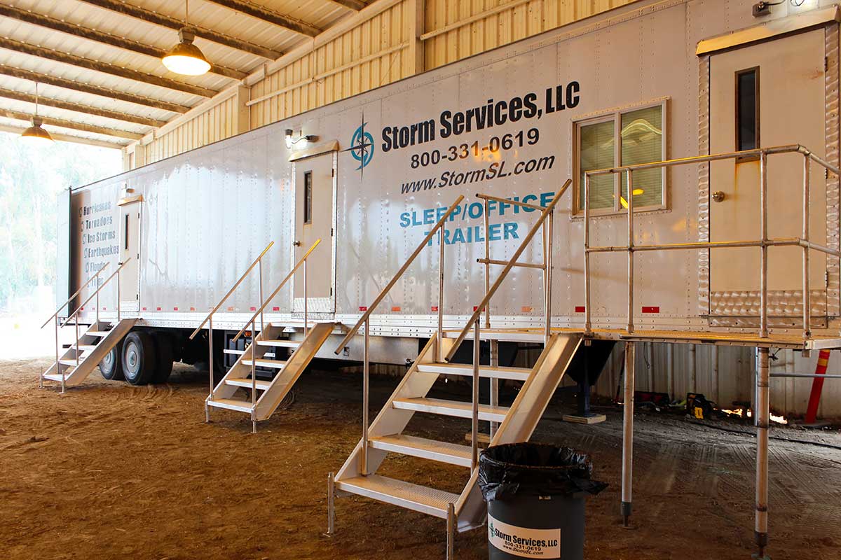 Combination sleep/office trailer for site management officials at a base camp.