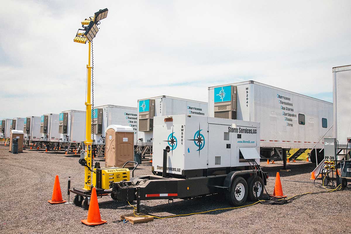 Light tower and generator on site at a base camp location.