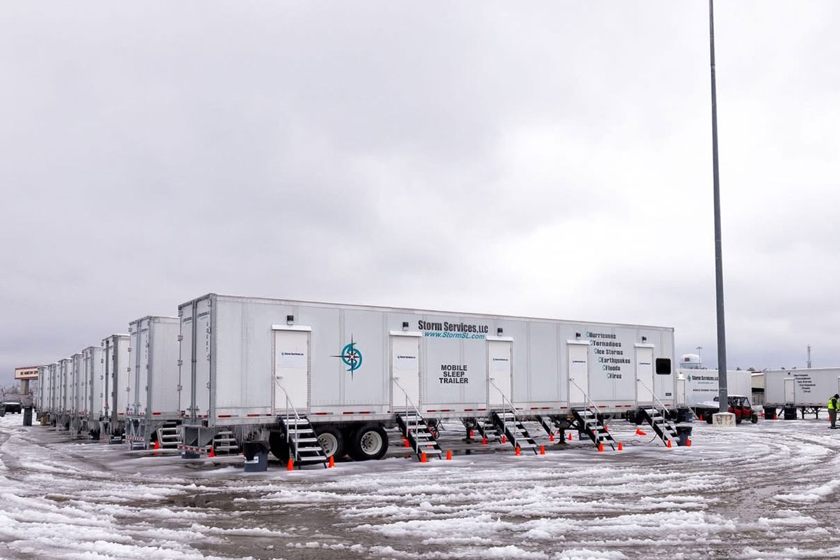 Aerial image of sleep trailers at a base camp.